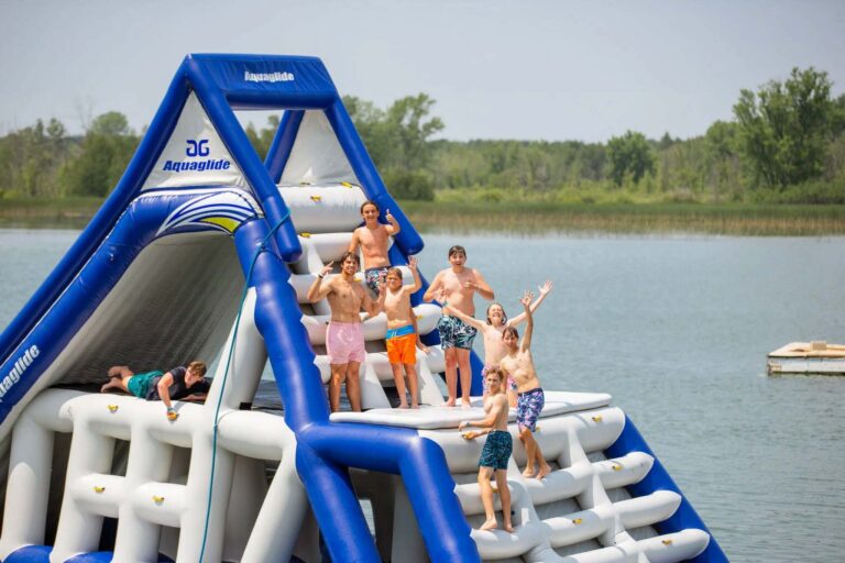 Teens on giant lake inflatable
