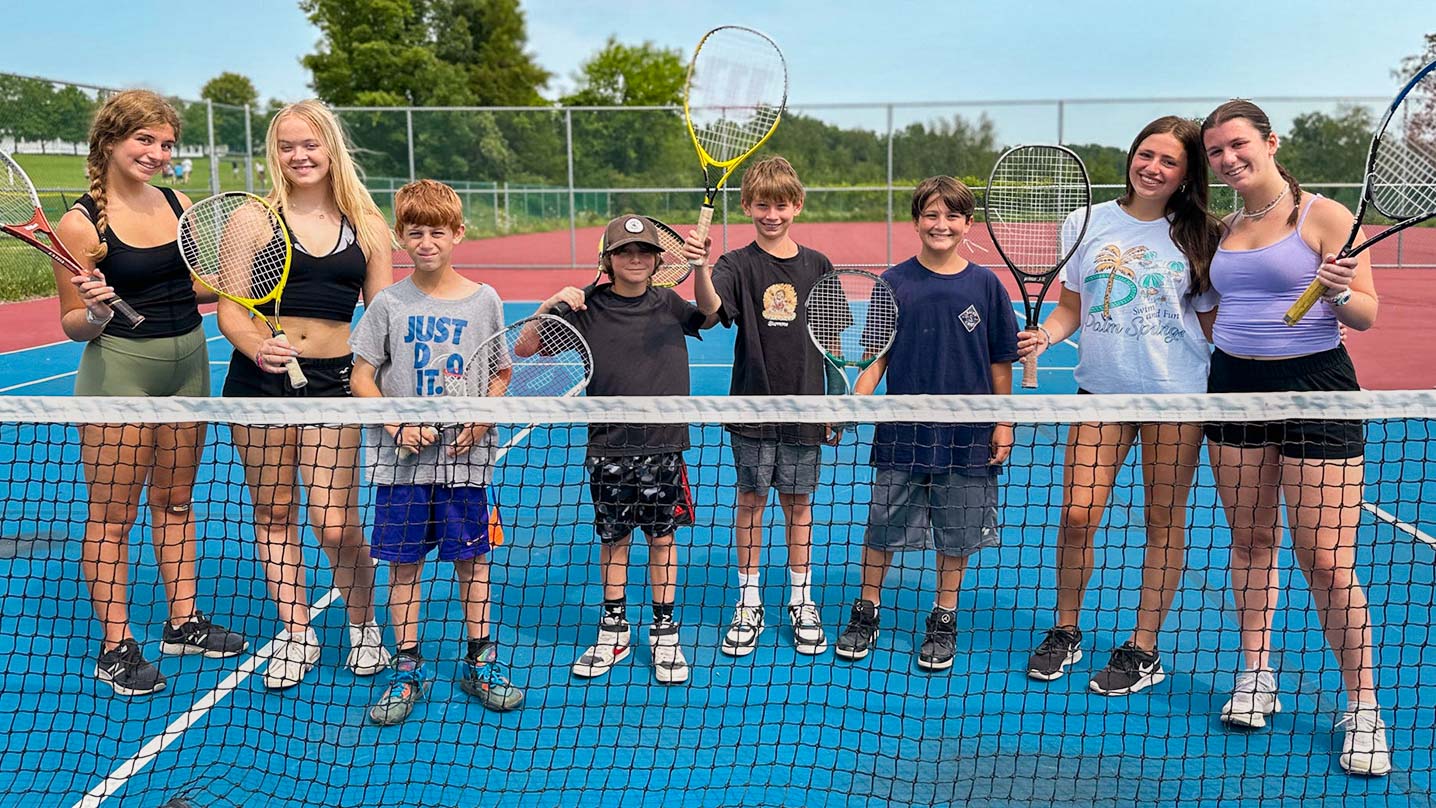 Campers playing tennis