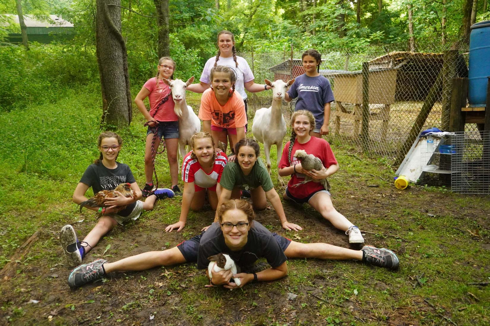 Girls holding animals
