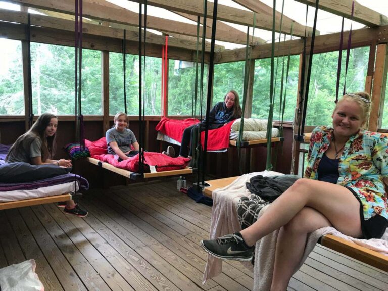 Campers in rustic cabin