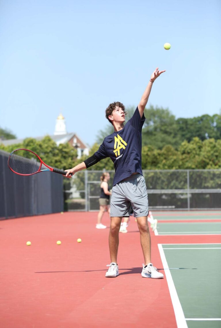 Boy playing tennis