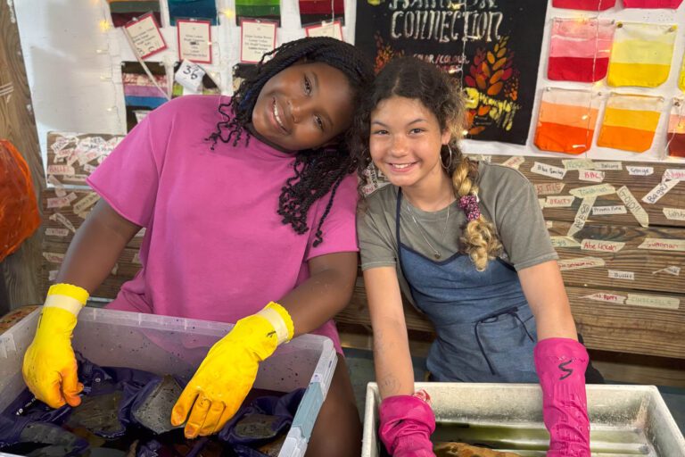 Girls dyeing fabric