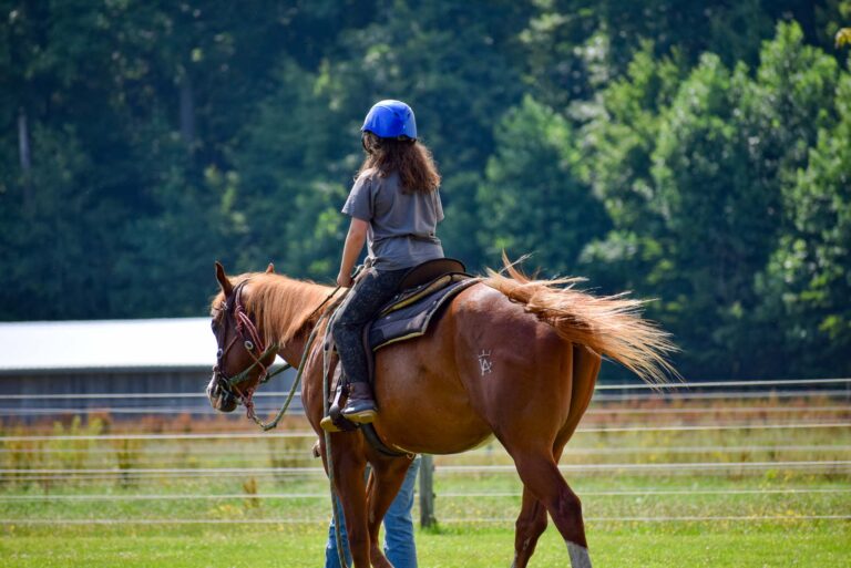 Girl riding a horse