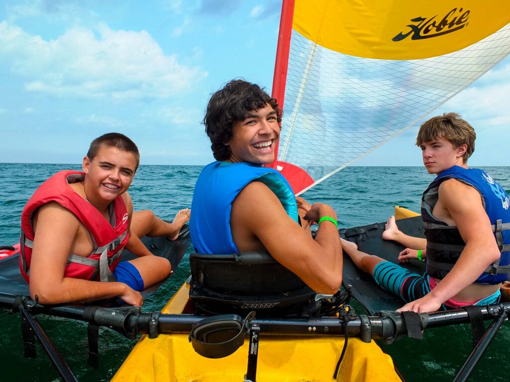 Boys on a sailboat