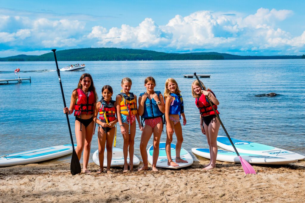 Group of girls with paddleboards