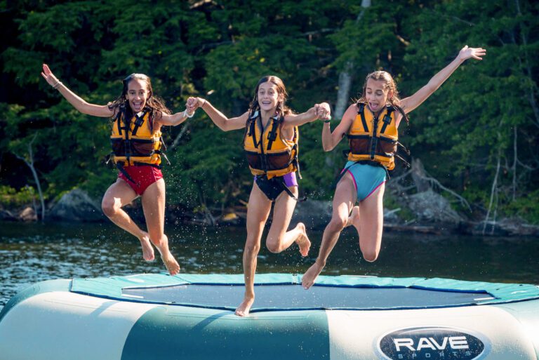 Three girls on a water trampoline