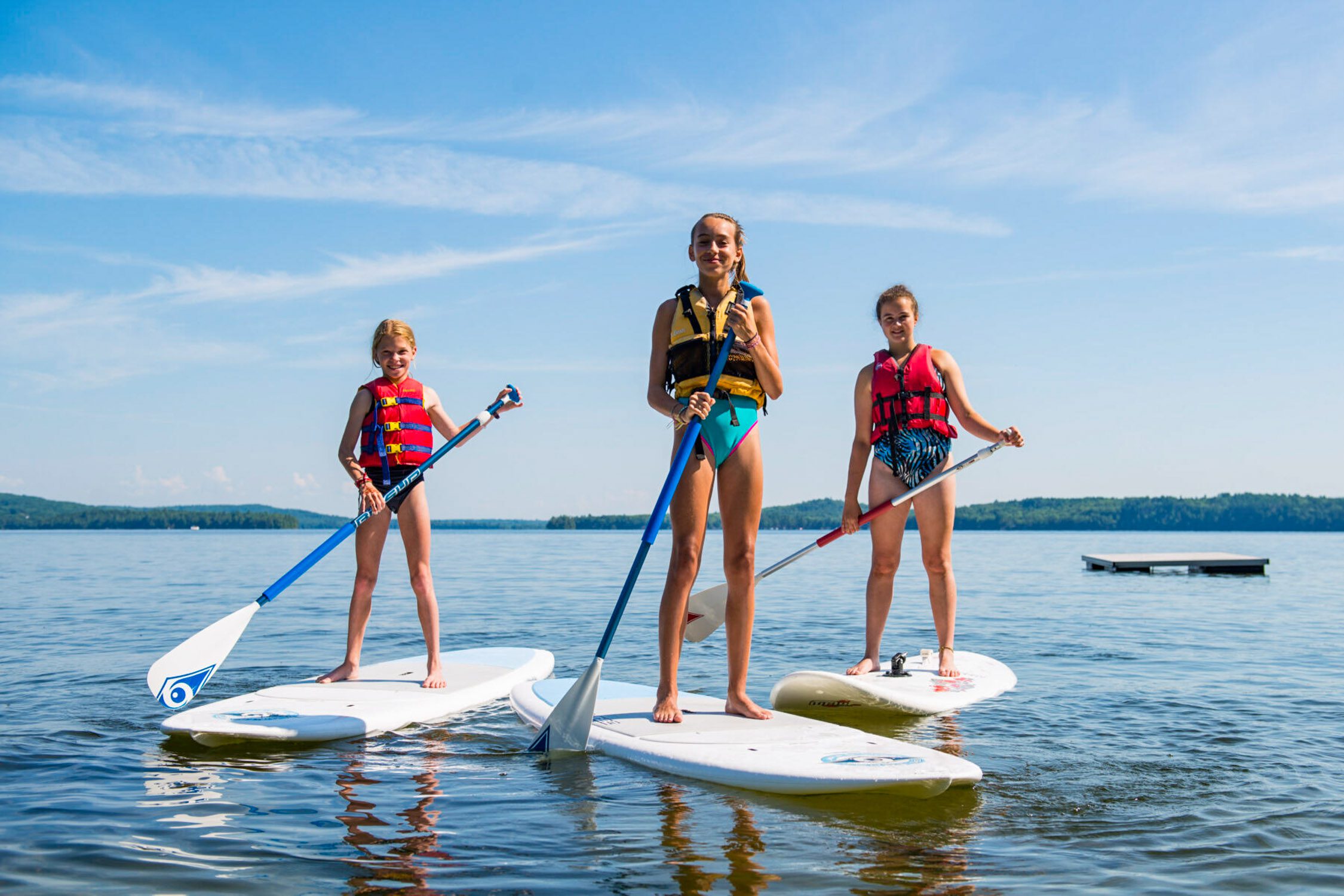 Girls on stand up paddleboards