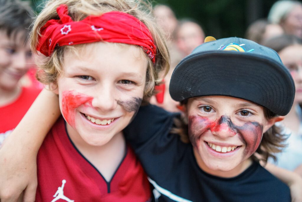 Two smiling boys with face paint