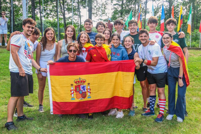 International campers holding flag of Spain