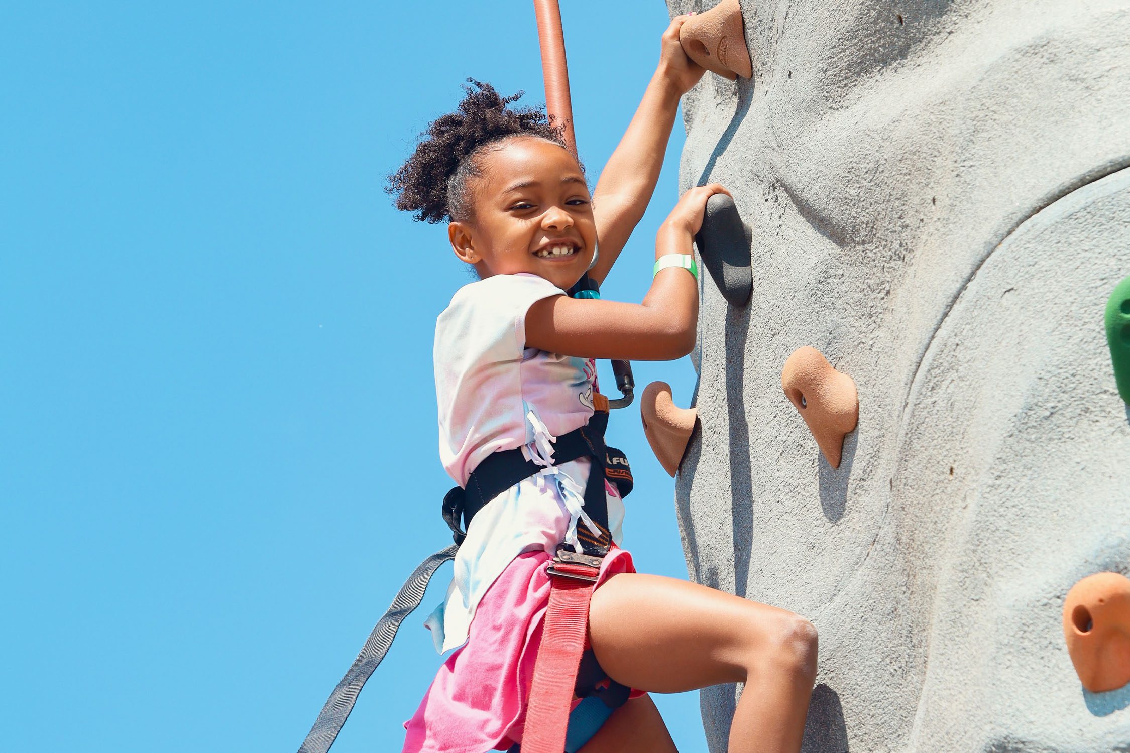 Photo of girl rock climbing