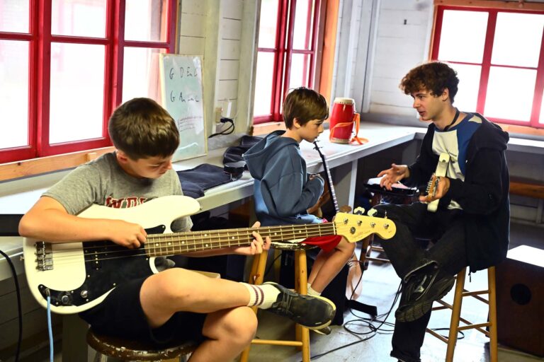 Boys learning guitar