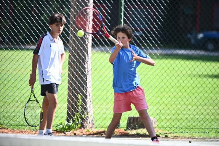Boy playing tennis