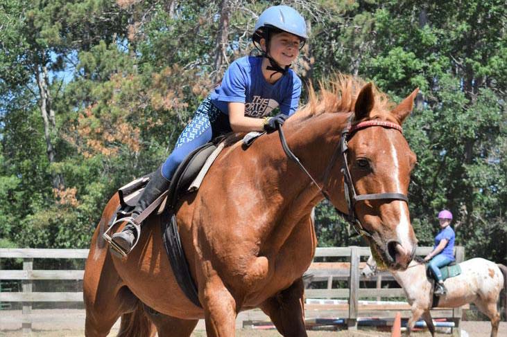 Girl horseback riding