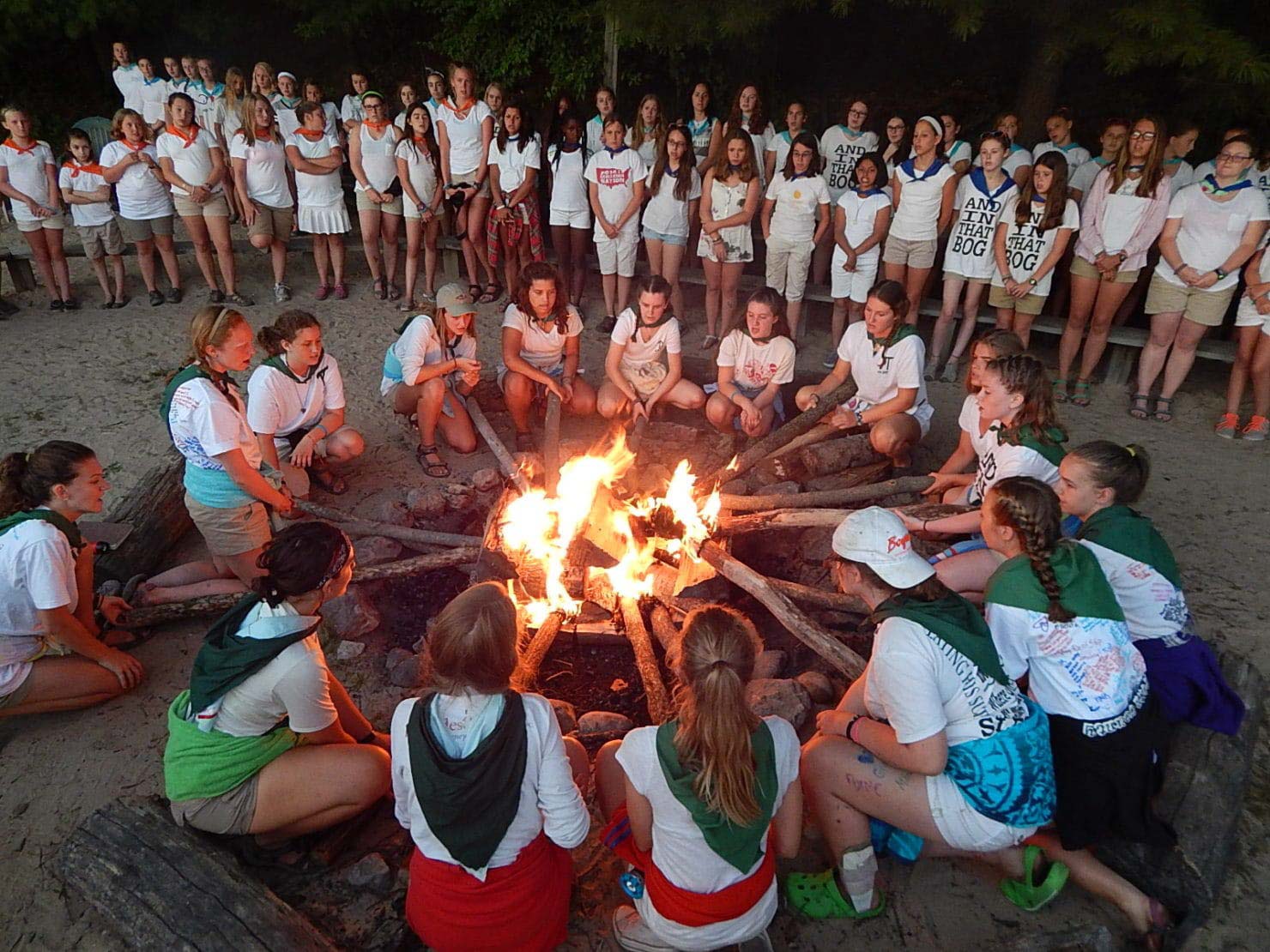 Girls around a campfire