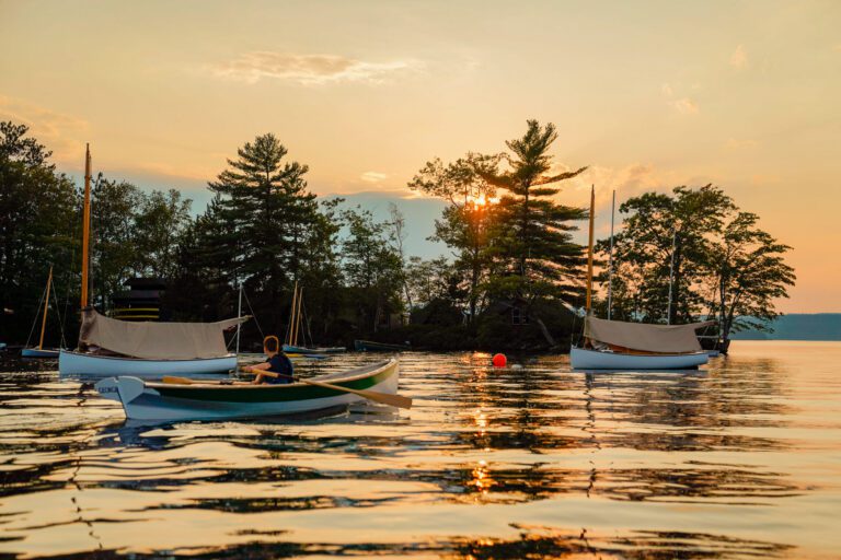 Camper in a rowboat at sunet