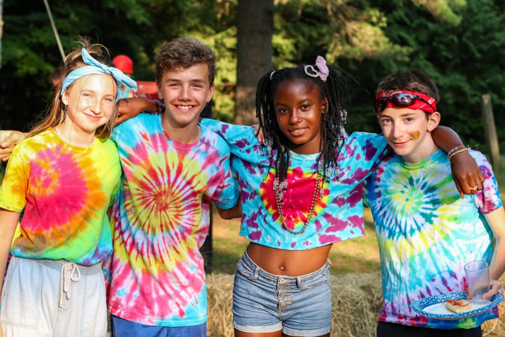 Teen campers in tie-dye shirts