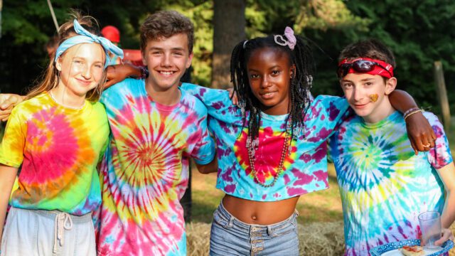 Teen campers in tie-dye shirts