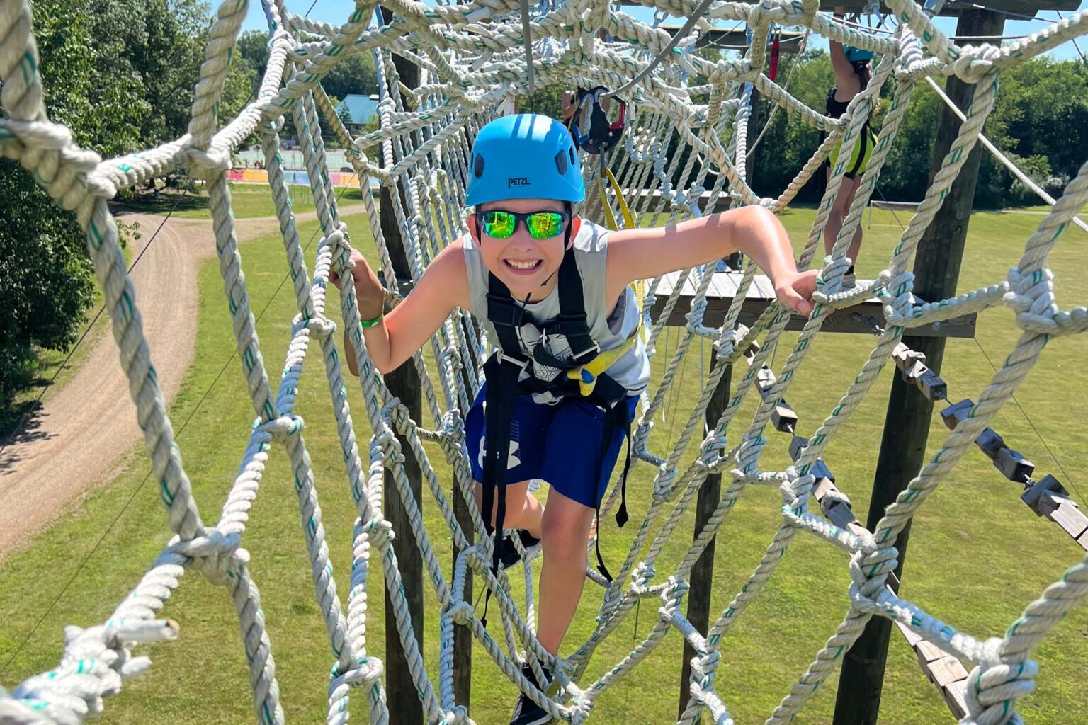 Boy on high ropes course