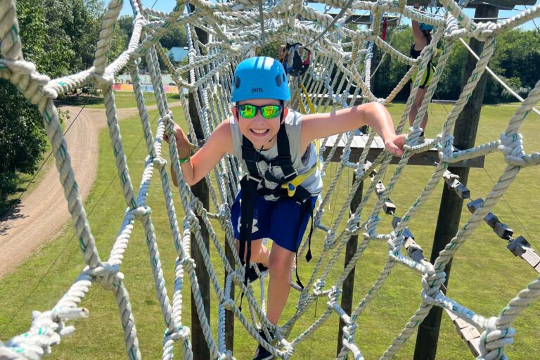 Boy on high ropes course