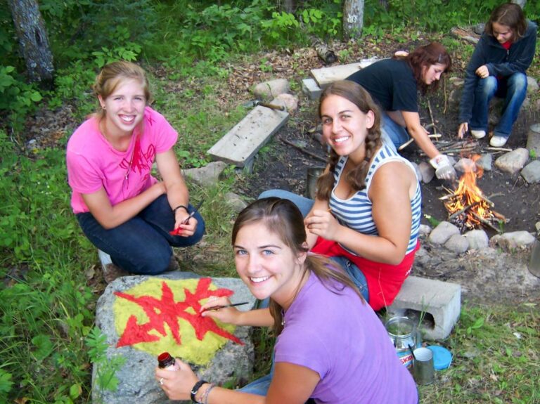 Girls hanging by camp fire