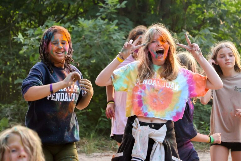 Campers covered in colored powder