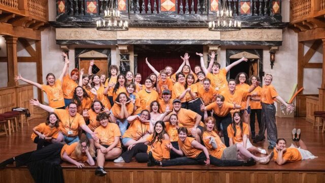 Campers celebrating on stage