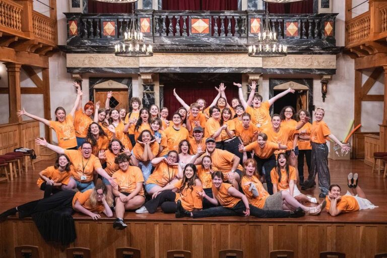 Campers celebrating on stage