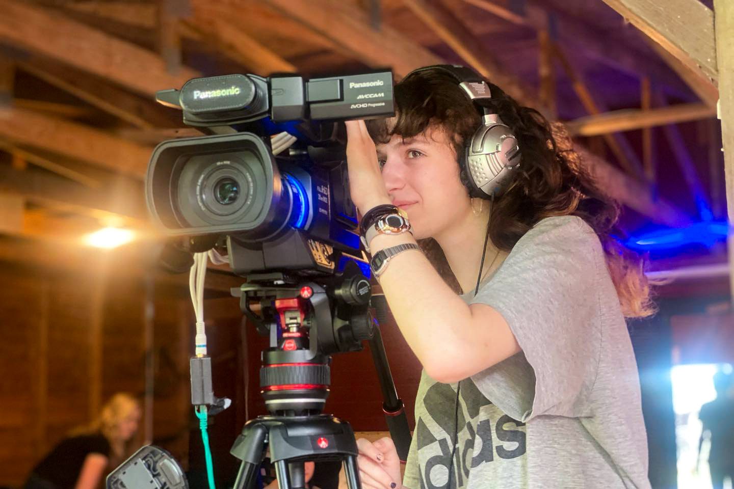 Girl operating video camera