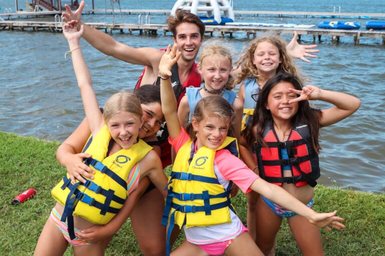 Excited campers by lake