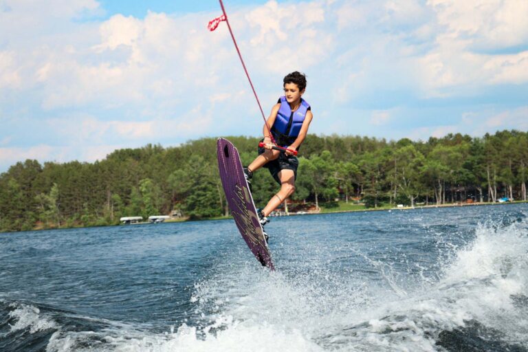 Wakeboarding boy getting huge air