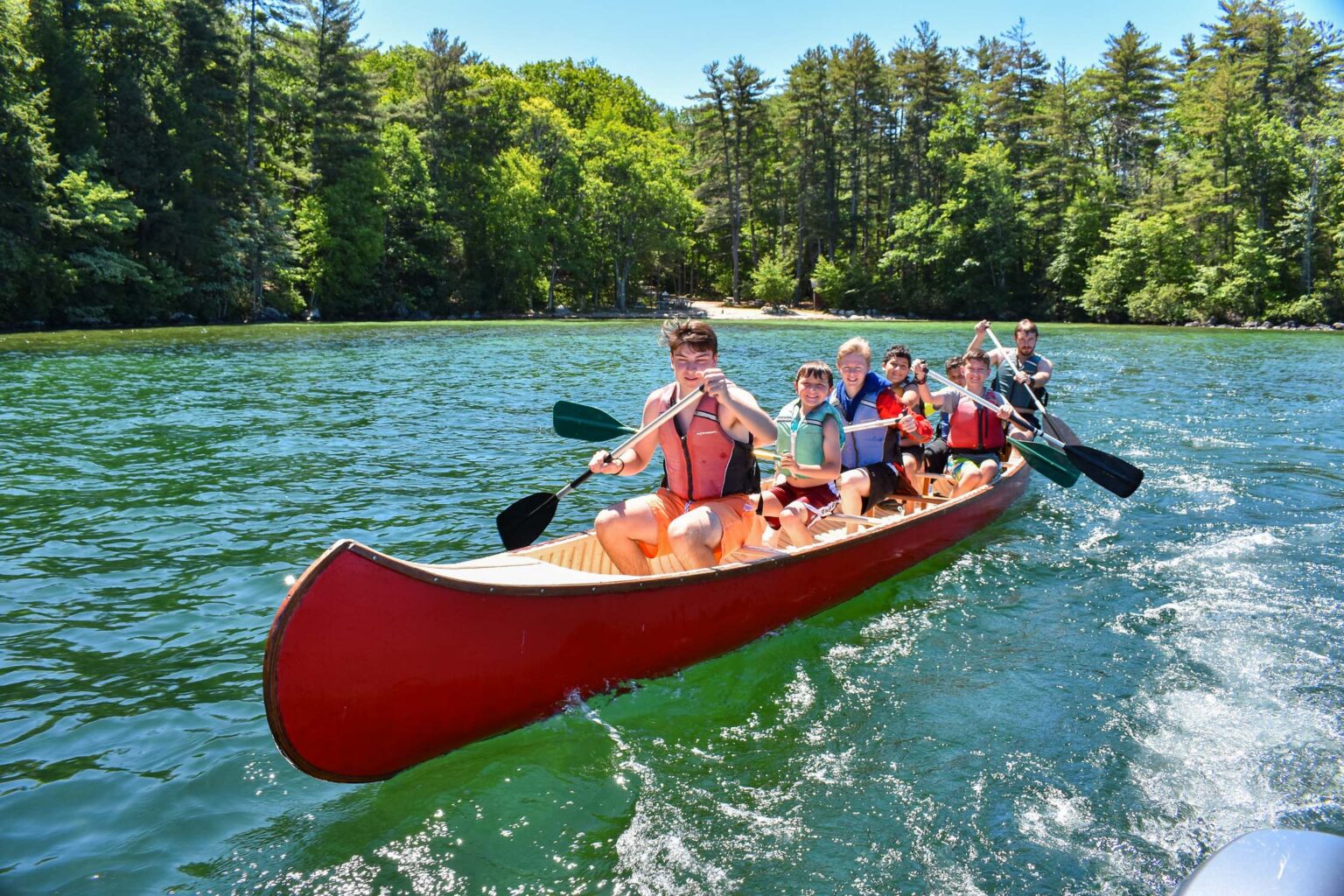 Boys in war canoe