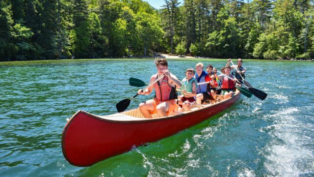 Boys in war canoe