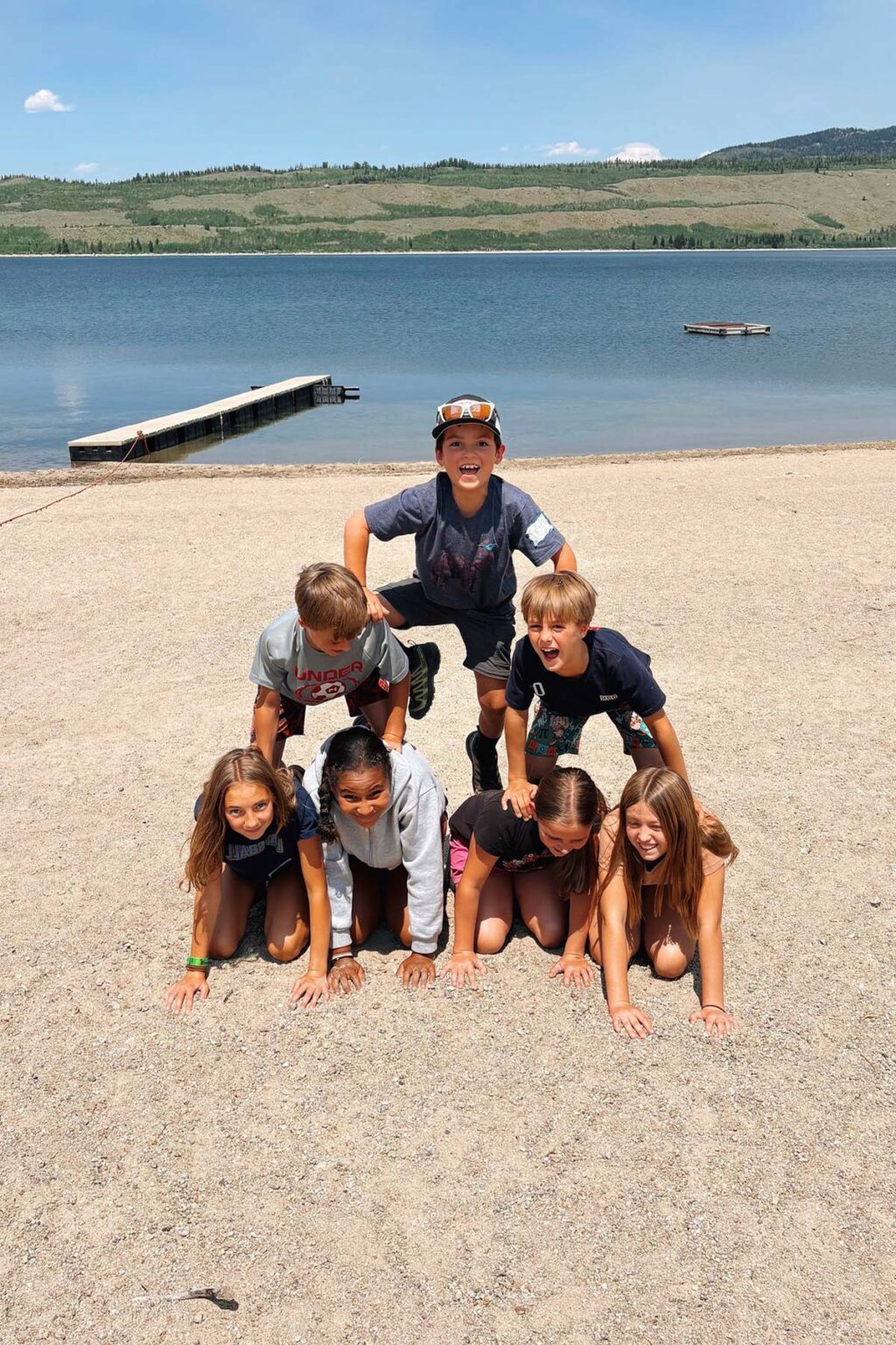 Campers making human pyramid