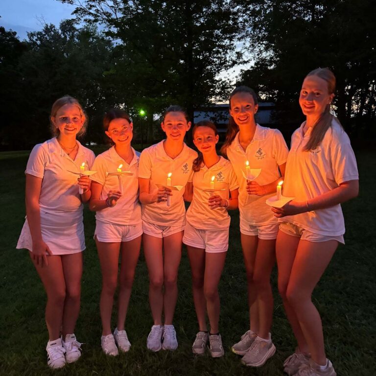 Girls holding candles