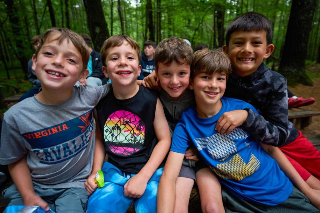 Joyful smiling boys in a forest