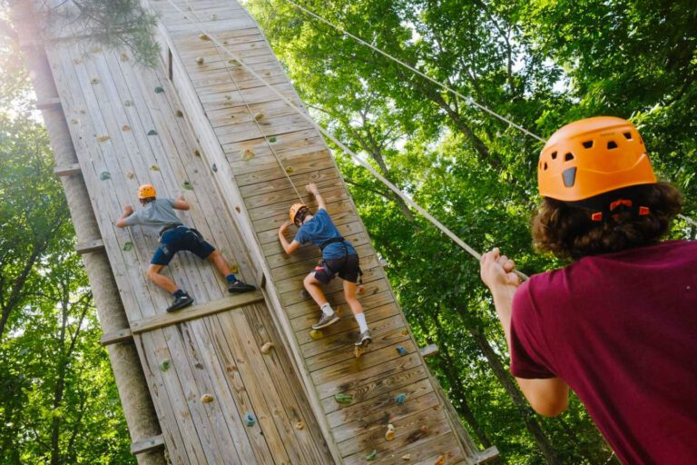 Campers on climbing wall