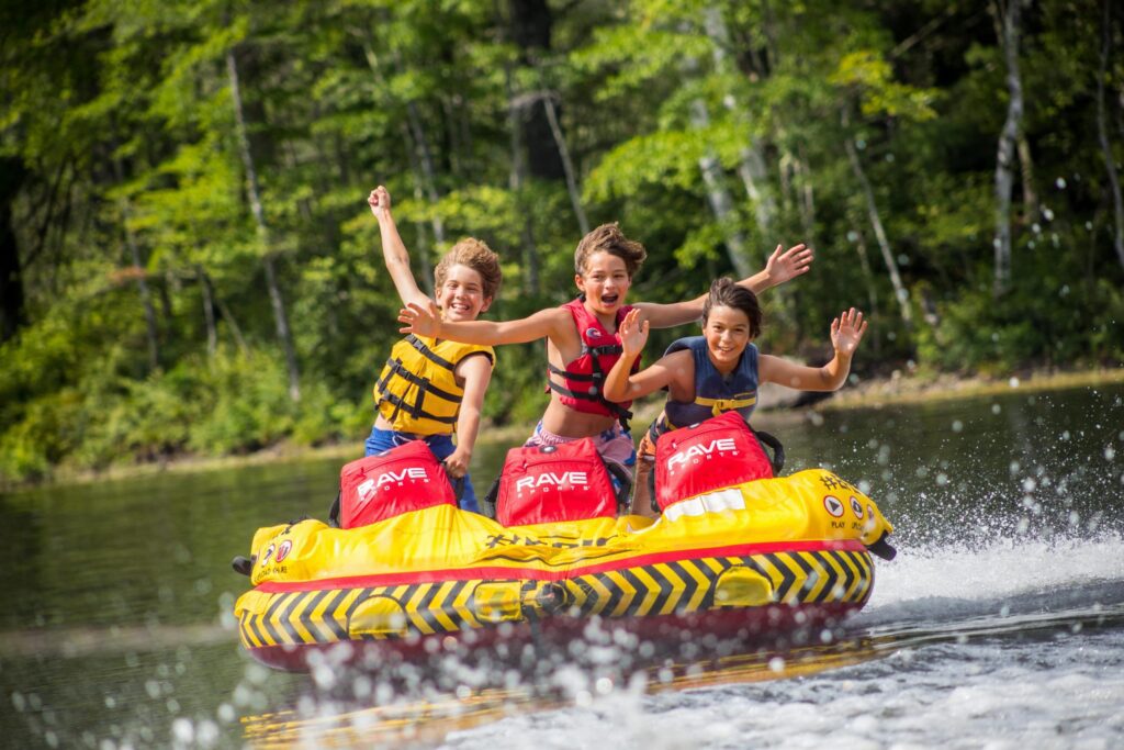 Action shot of three boys tubing