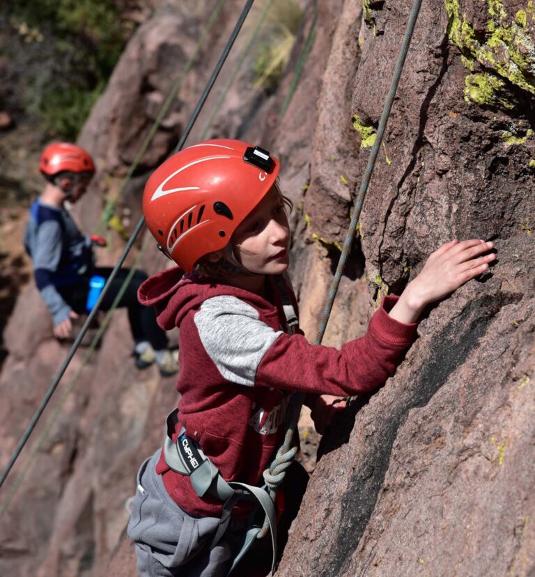 Boy rock climbing