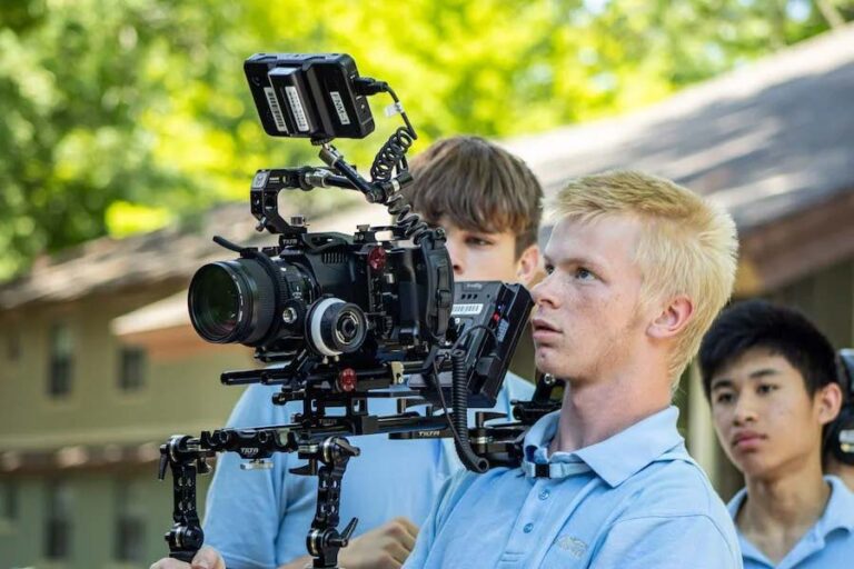 Boy holding video camera