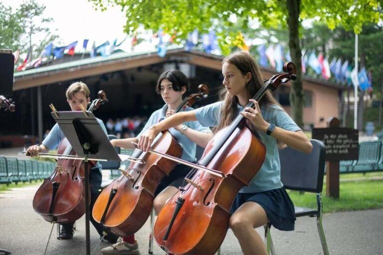 Girls playing instruments outside