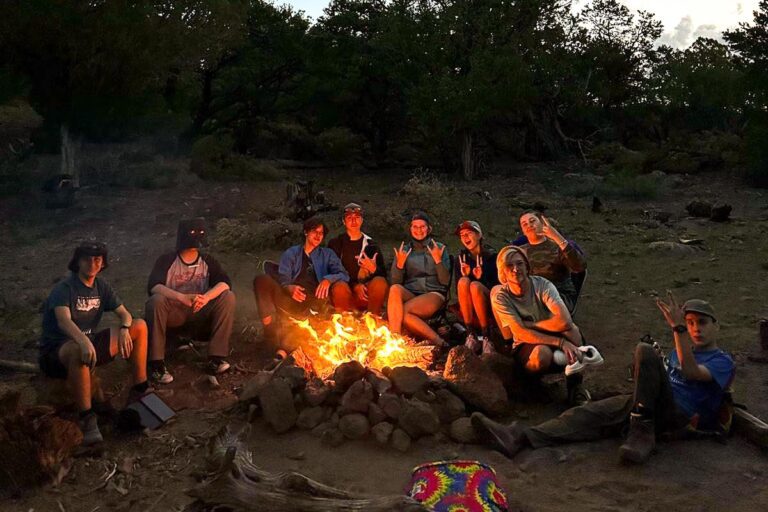 Campers around campfire