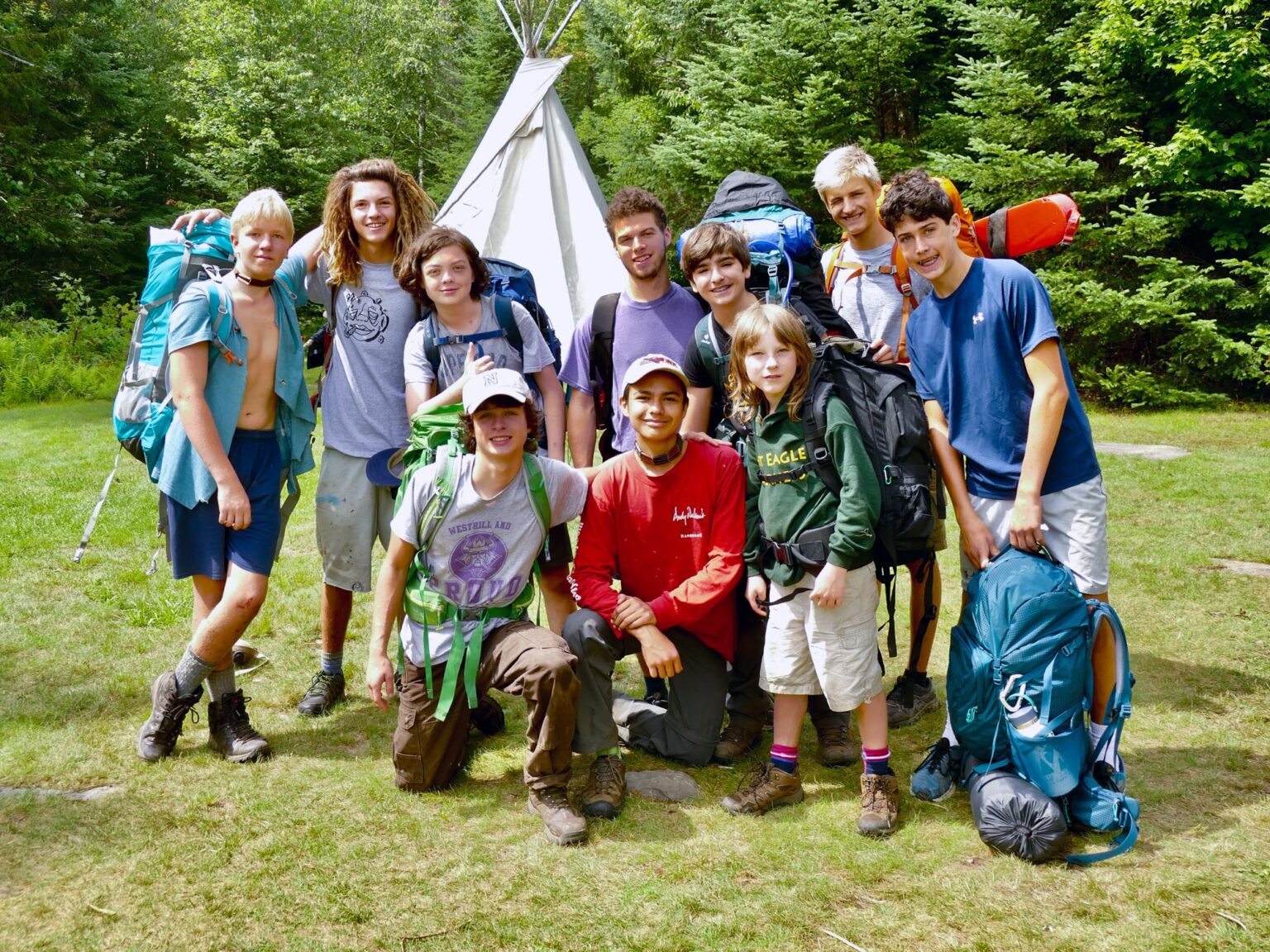 Group of boys wearing backpacking gear