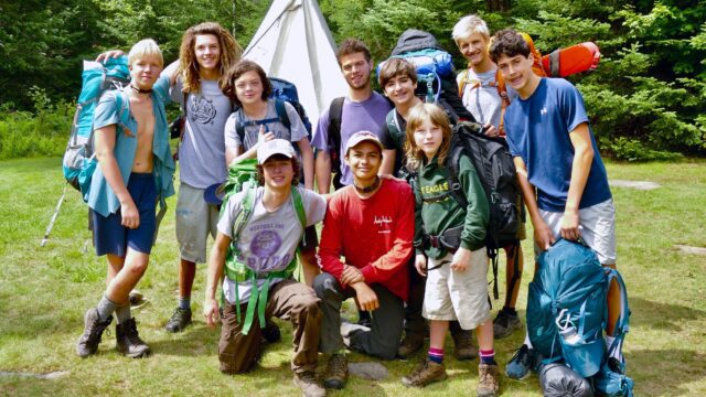 Group of boys wearing backpacking gear