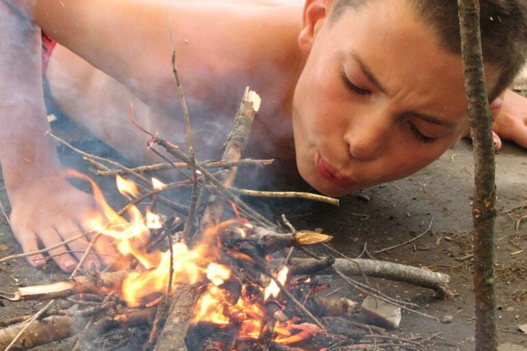 Boy building a fire