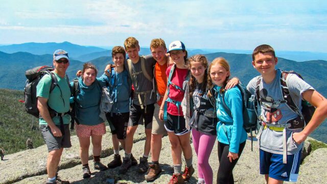 Group of campers on mountain summit