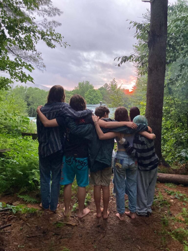 Campers enjoying a sunset together