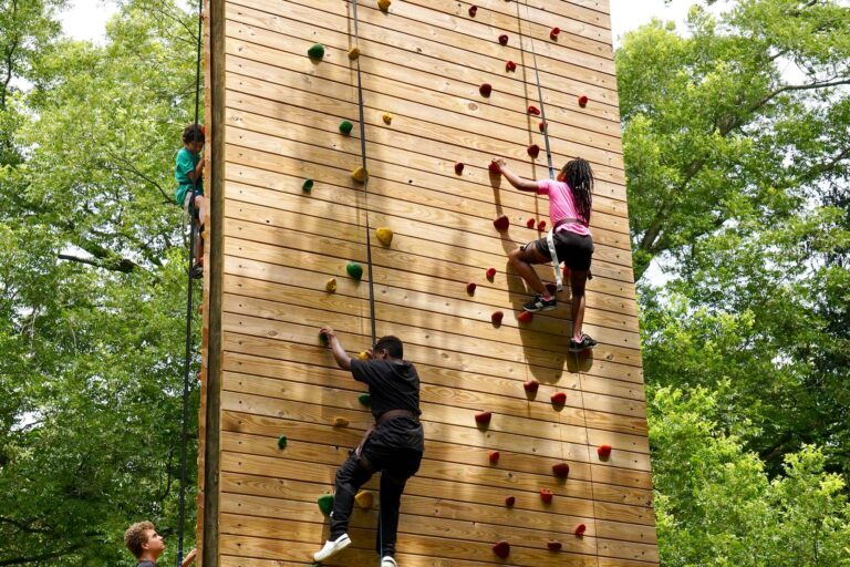 Campers on climbing wall