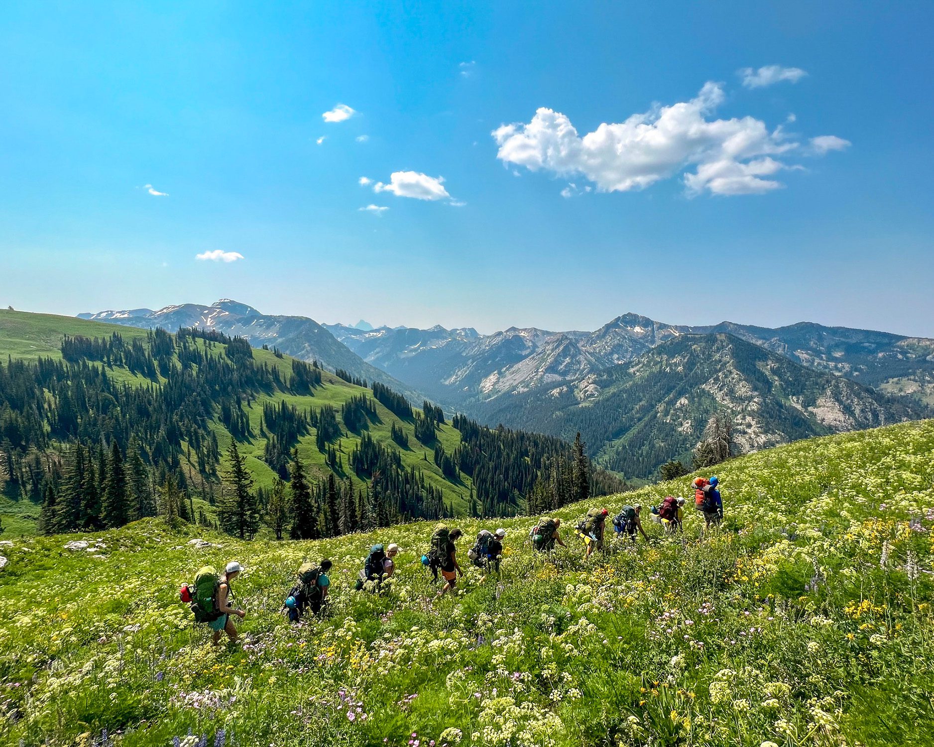 Kids backpacking through mountains in Wyoming