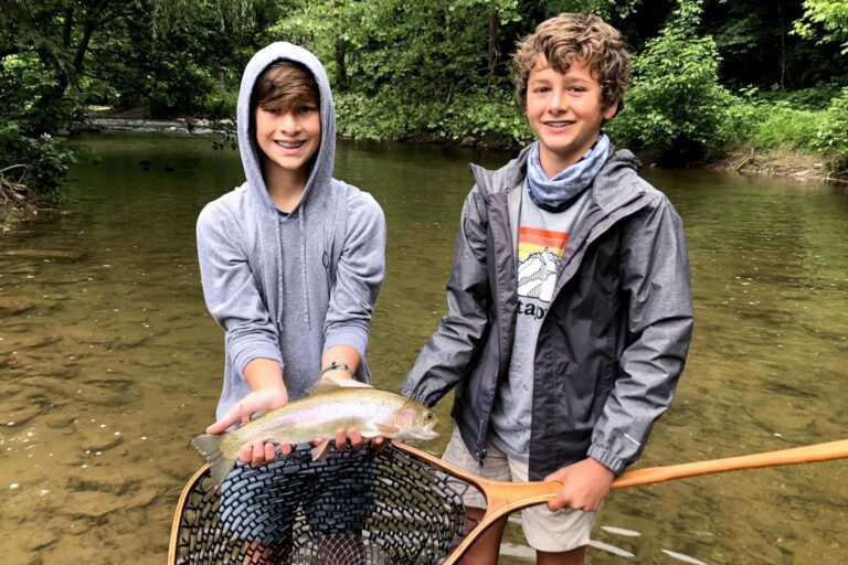 Boys fly fishing