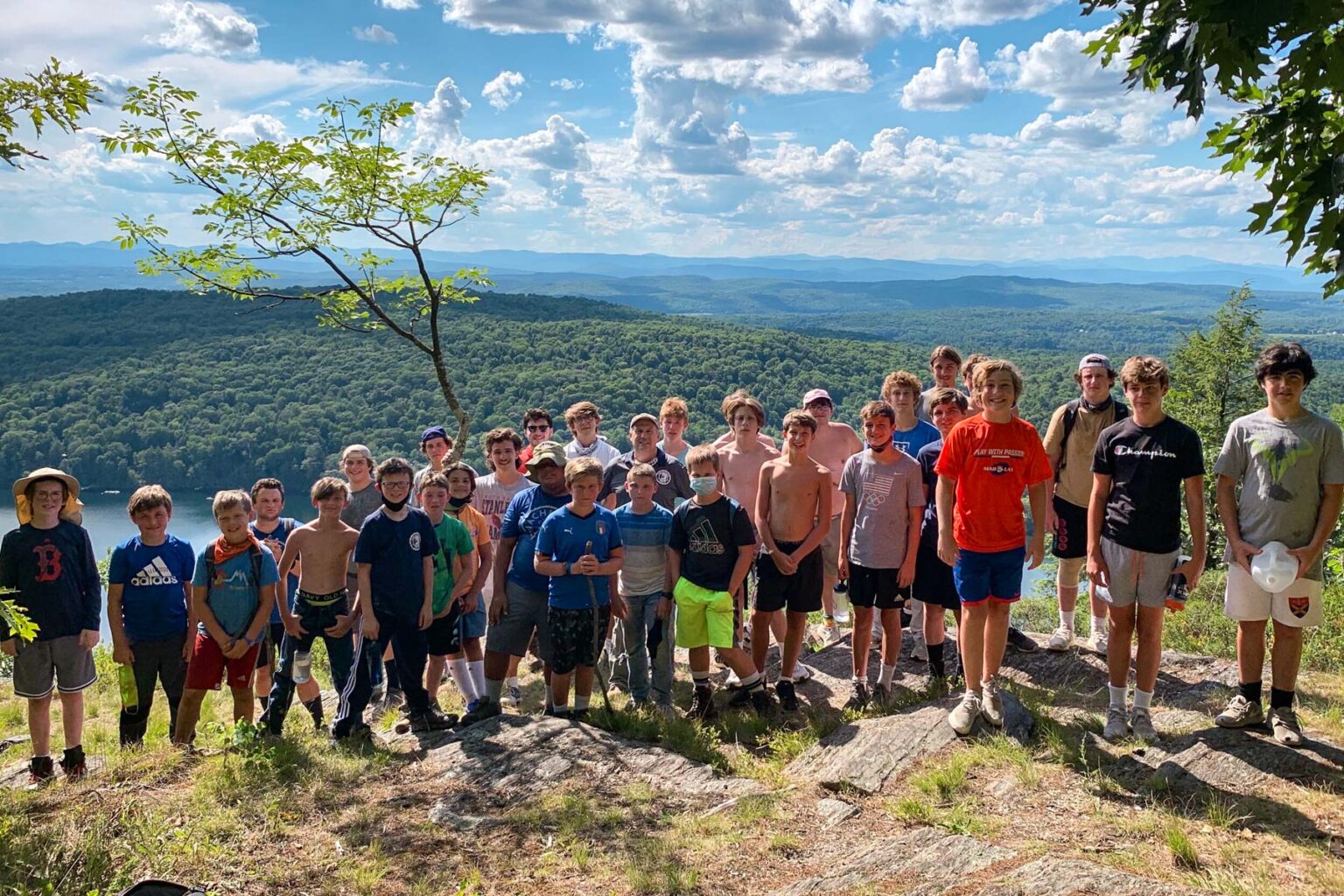 Boys on top of a mountain